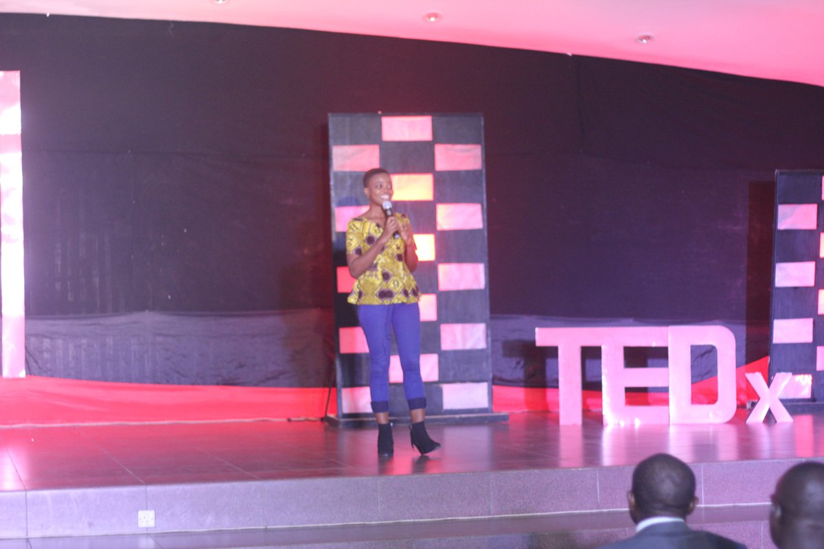 Ivy Barley talking on stage during a TEDx KNUST event