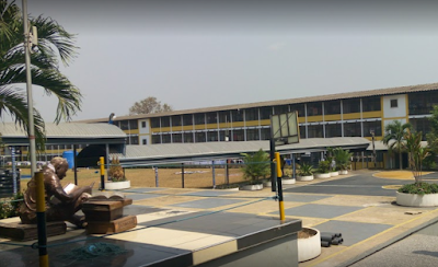 Inside the Katanga Hall, KNUST a sculpture of a student reading and the basketball court