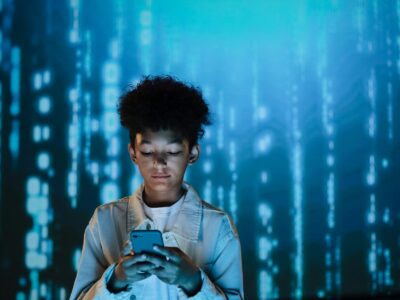 a boy using a mobile phone